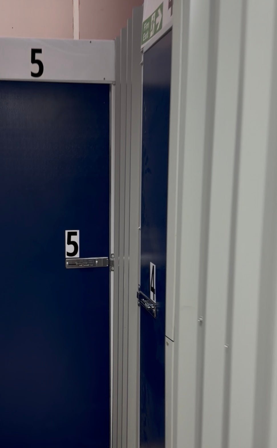 The secure latch on a modern blue storage unit at the Isle Store facility in Cowes.