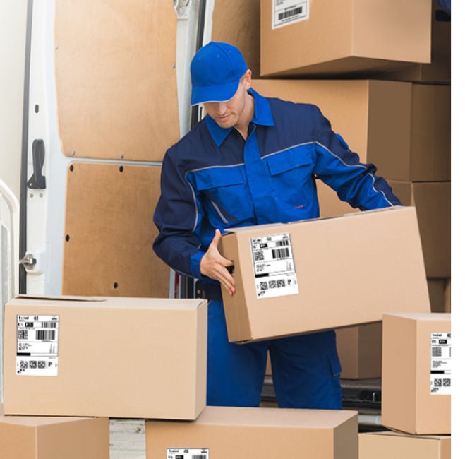 Isle Store staff member collecting boxes from a customer on the Isle of Wight.